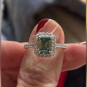 Gorgeous blue moissanite emerald shape diamond.